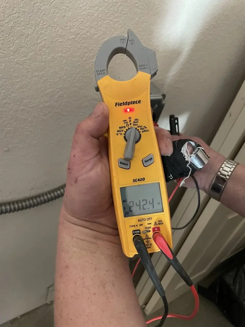 Voltage testing with clamp meter during Outlet Installation in Santa Ana